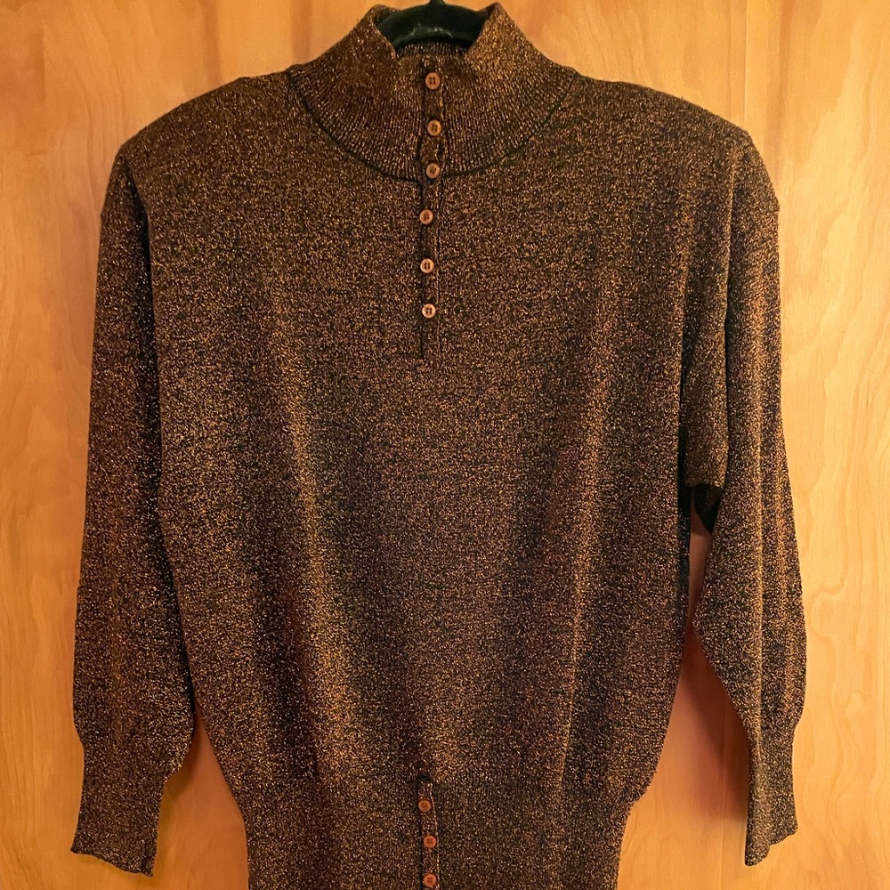 Woman’s copper metallic and black knit top.